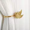 Winged Brass Curtain Holder